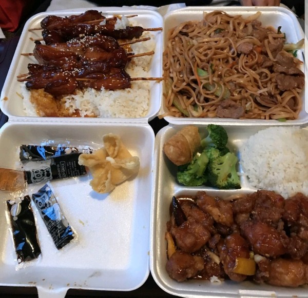 Chicken teriyaki skewers with lo mein and orange chicken