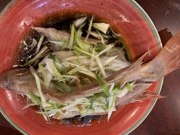 Steamed whole fish with ginger and scallions